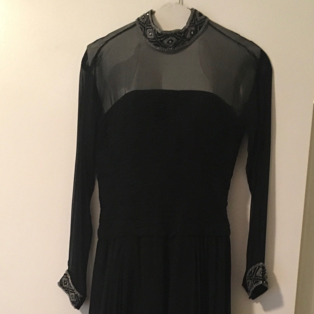 Long sheer sleeve ball gown